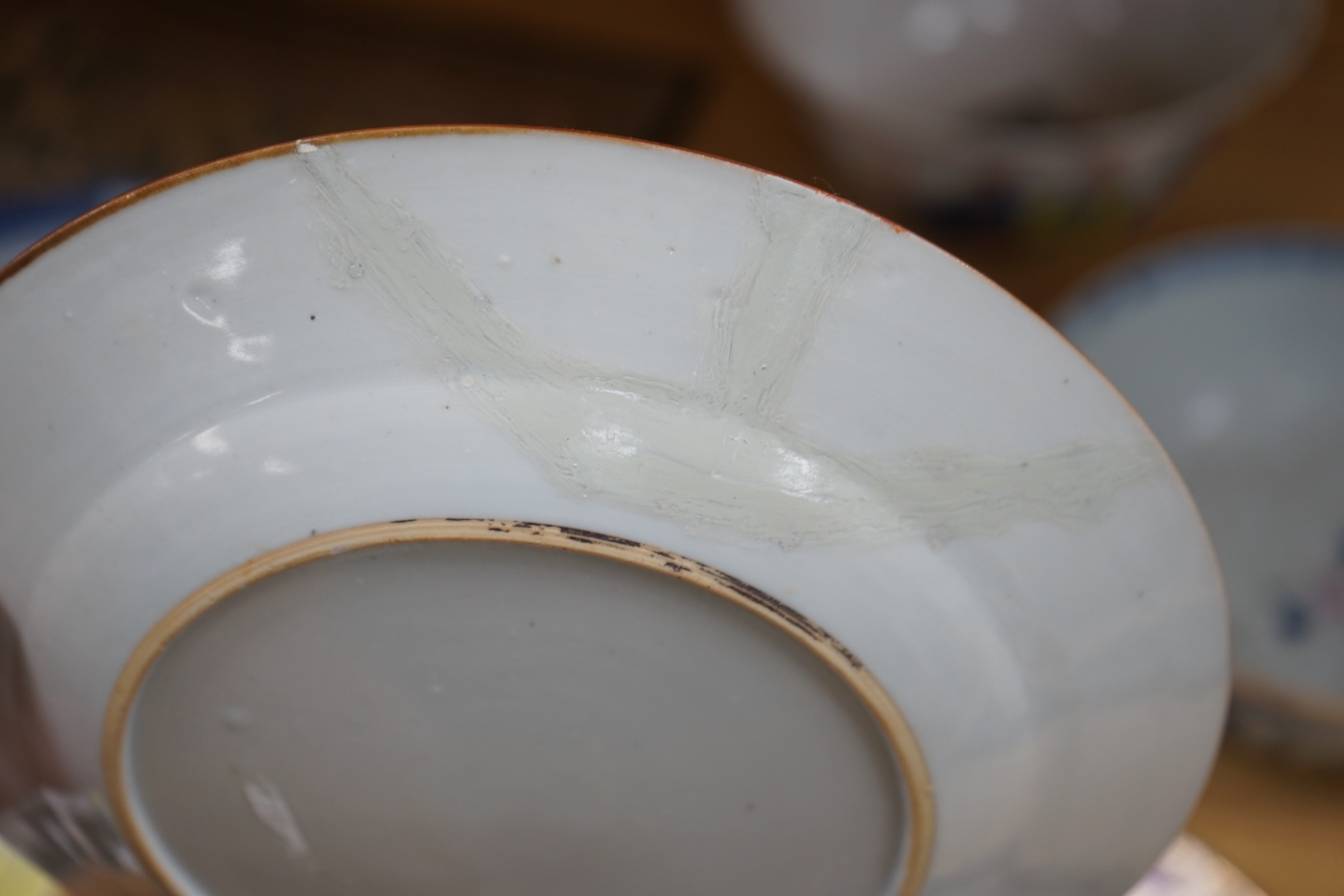 A group of 18th century and later Chinese enamelled and blue and white porcelain dishes and three bowls, Largest dish 35.5 cm diameter